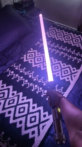 Customer with AstraSabers lightsaber